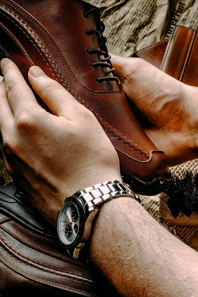 Man Holding Shoes 